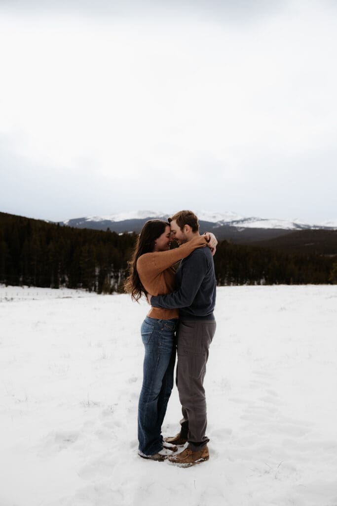 Photograph of engagement session in the Big Horn Mountains where the couple are embracing each other.