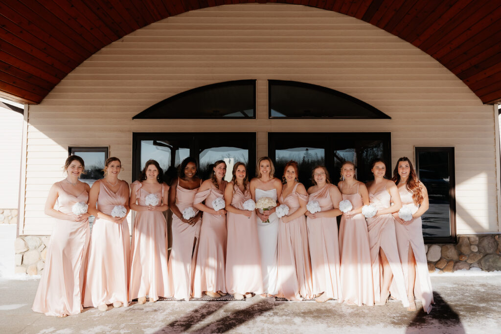 Photograph of a winter wedding at the Tenstrike Community Church in Bemidji, Minnesota by Minnesota wedding photographer and videographer, Alyssa Thompson Media.