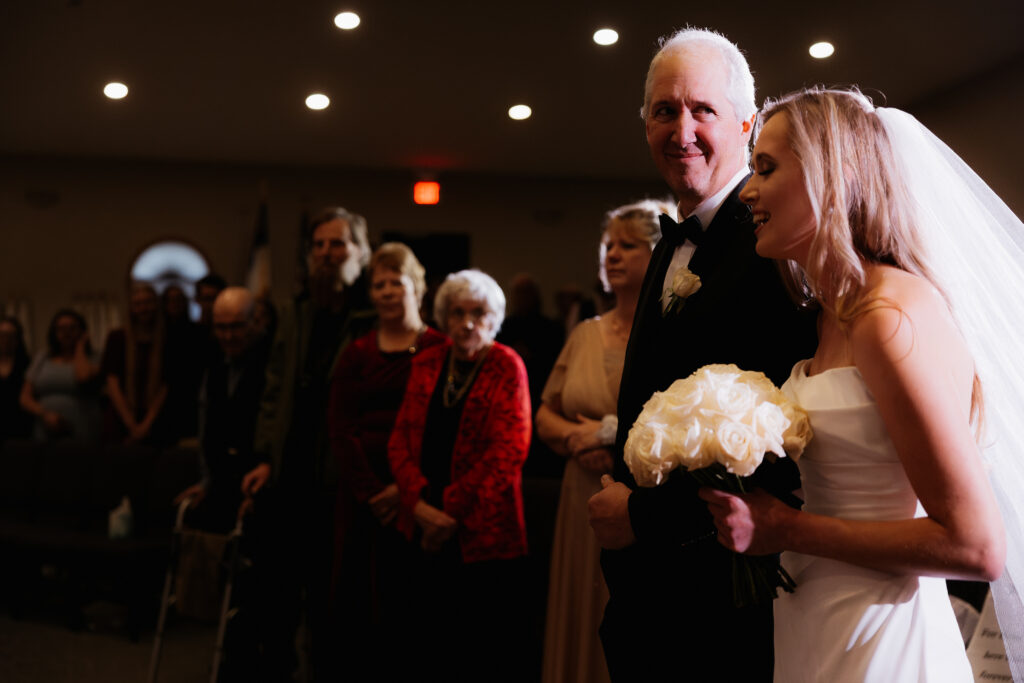 Photograph of a winter wedding at the Tenstrike Community Church in Bemidji, Minnesota by Minnesota wedding photographer and videographer, Alyssa Thompson Media.