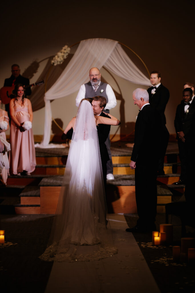 Photograph of a winter wedding at the Tenstrike Community Church in Bemidji, Minnesota by Minnesota wedding photographer and videographer, Alyssa Thompson Media.