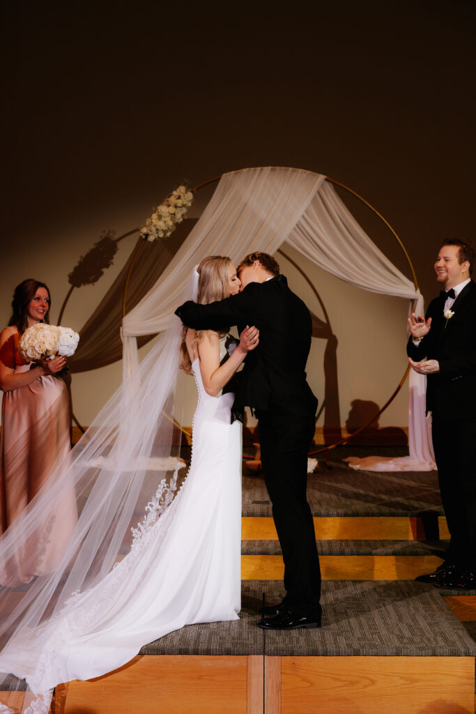 Photograph of a winter wedding at the Tenstrike Community Church in Bemidji, Minnesota by Minnesota wedding photographer and videographer, Alyssa Thompson Media.