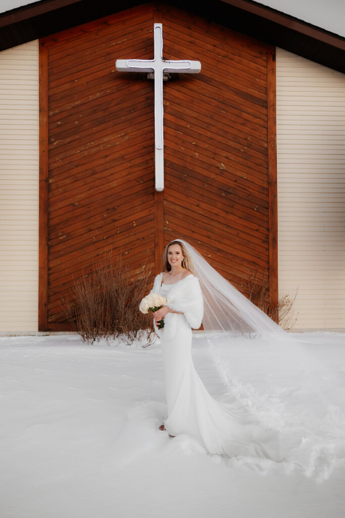 Photograph of a winter wedding at the Tenstrike Community Church in Bemidji, Minnesota by Minnesota wedding photographer and videographer, Alyssa Thompson Media.