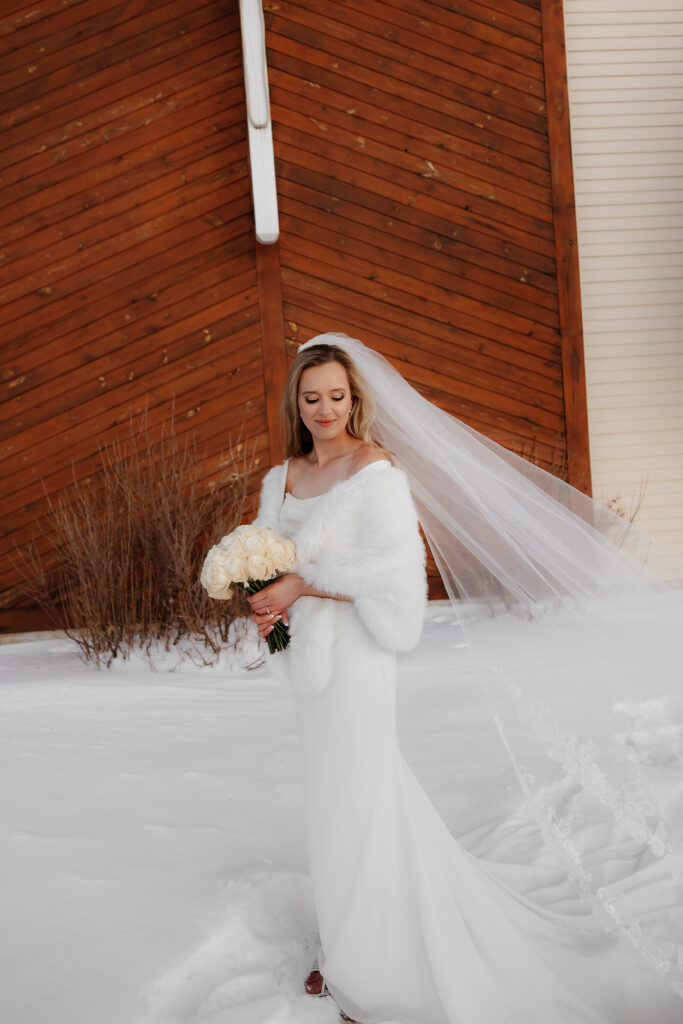 Photograph of a winter wedding at the Tenstrike Community Church in Bemidji, Minnesota by Minnesota wedding photographer and videographer, Alyssa Thompson Media.